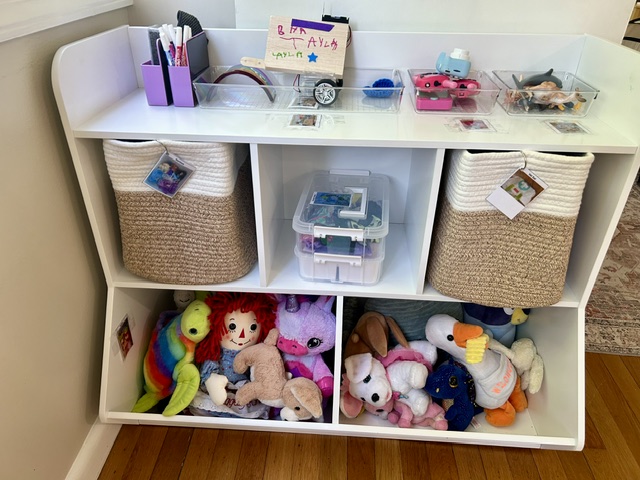 Labeled baskets and bins with photo labels for toy organization